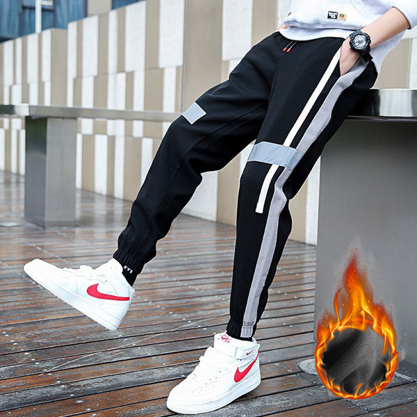 Vīriešu sporta garās bikses melnā krāsā ar apmalīti