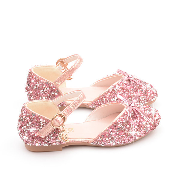 Dječje sjajne cipele s trakom i privjeskom