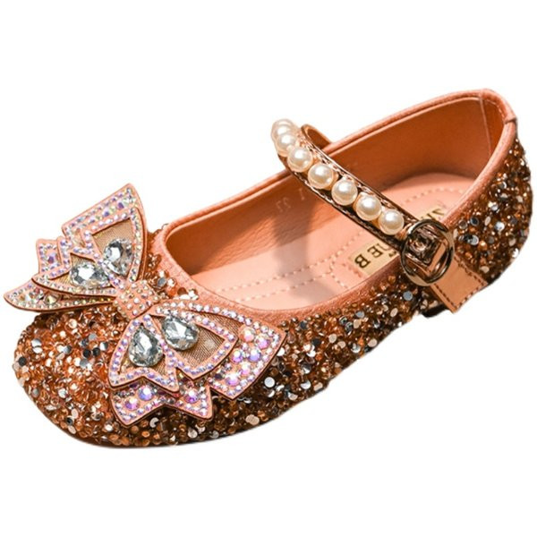 Bērnu apavi ar plakanām zolēm un akmeņiem