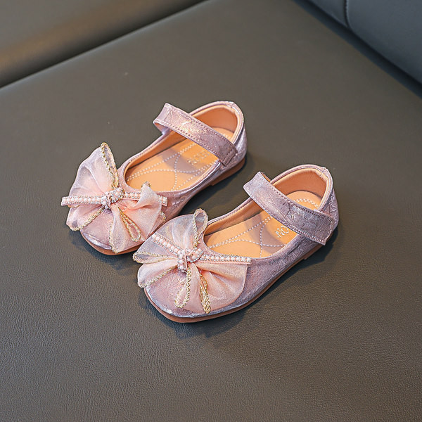 Ikdienas bērnu apavi ar plakanām zolēm un lentes rotājumu