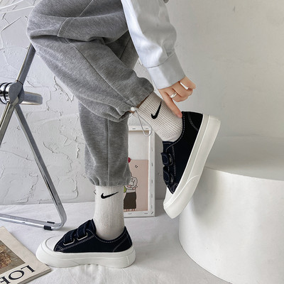 Naiste tekstiilist takjakinnitusega tossud