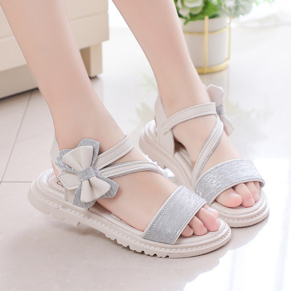 Moodsad kunstnahast paelaga laste sandaalid - tüdrukutele