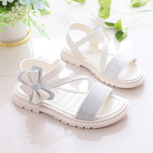 Moodsad kunstnahast paelaga laste sandaalid - tüdrukutele