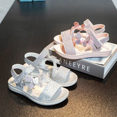 Brokaadi ja paelaga laste sandaalid