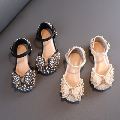 Children`s sandals with flat sole and pearl decoration