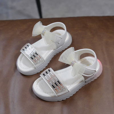 Φωτεινά παιδικά σανδάλια με κορδέλα και επίπεδη σόλα