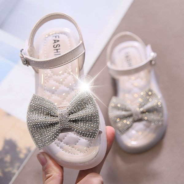 Modernas sandales ar lentīti un akmentiņiem trīs krāsās