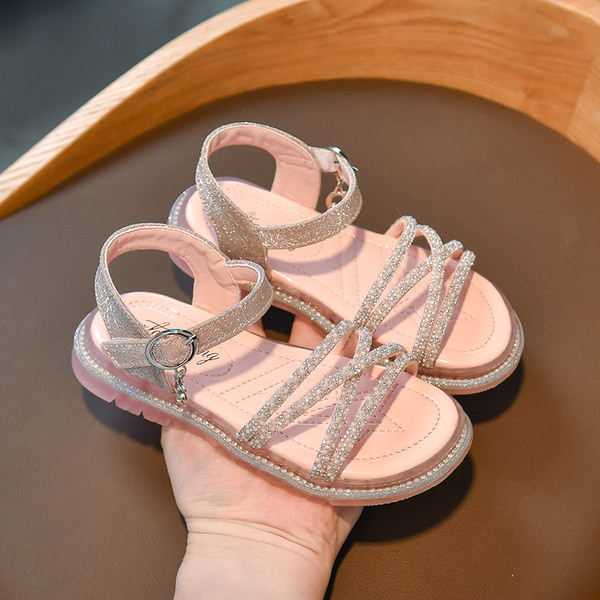 Bērnu sandales ar krusteniskām siksnām un dekorācijas akmeņiem