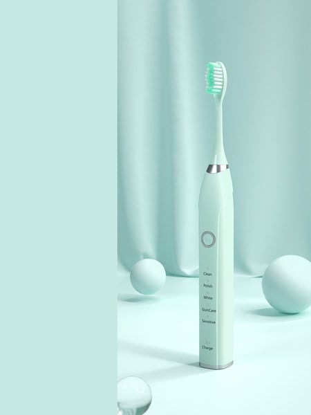 Electric toothbrush with additional nozzle