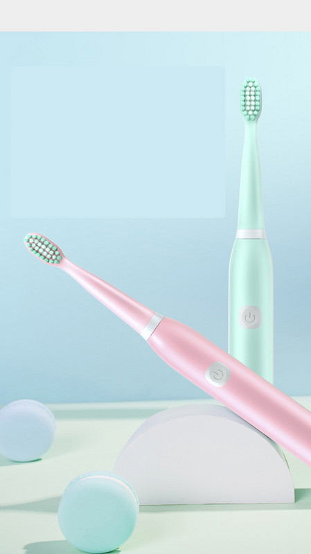 Electric toothbrush in green and pink