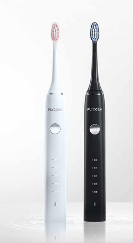 Electric toothbrush in white and black