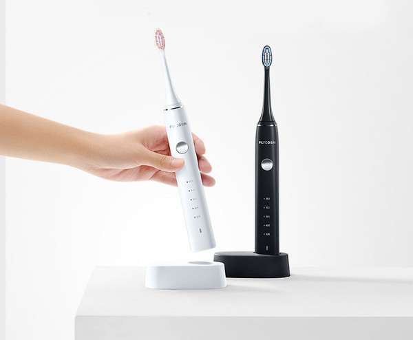 Elektriskā zobu birste baltā un melnā krāsā