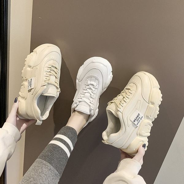 Sieviešu apavi ar šņorēm un augstām zolēm divās krāsās