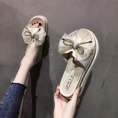 Sieviešu čības ar plakanu zoli ar lentīti un dekorācijas akmeņiem