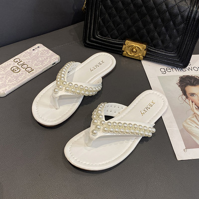 Sieviešu čības starp pirkstiem ar pērļu rotājumu