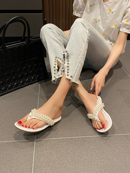 Sieviešu čības starp pirkstiem ar pērļu rotājumu