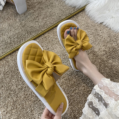 Ikdienas sieviešu čības ar plakanu zoli un lentes rotājumu - eko āda