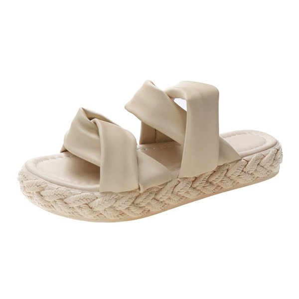 Jauns sieviešu čību modelis ar plakanu zoli un ādas krusteniskām siksnām