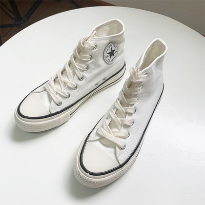 Καθημερινά αθλητικά παπούτσια με υφάσματα με έμβλημα