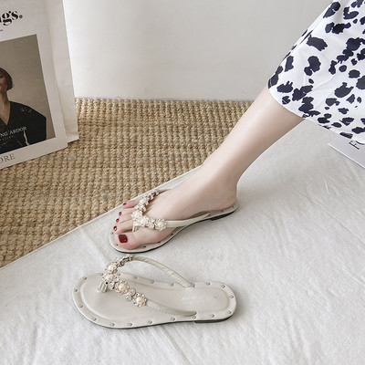 Γυναικείες παντόφλες ανάμεσα στα δάχτυλα με διακοσμητικές πέτρες και πέρλες