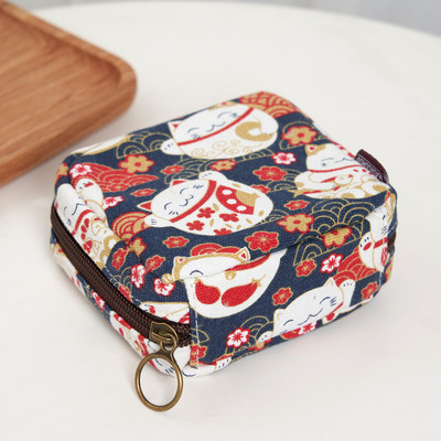 Γυναικείο μίνι πορτοφόλι με φερμουάρ και πολύχρωμες εφαρμογές