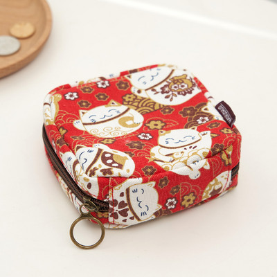 Γυναικείο μίνι πορτοφόλι με φερμουάρ και πολύχρωμες εφαρμογές