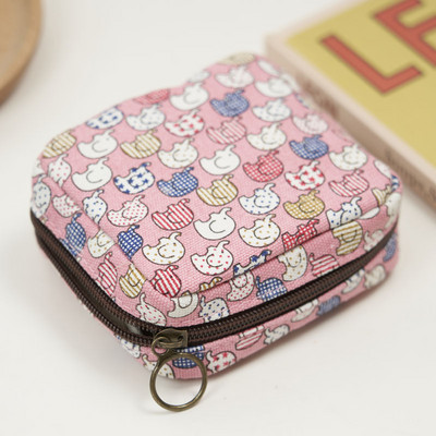 Γυναικείο μίνι πορτοφόλι με φερμουάρ και πολύχρωμες εφαρμογές