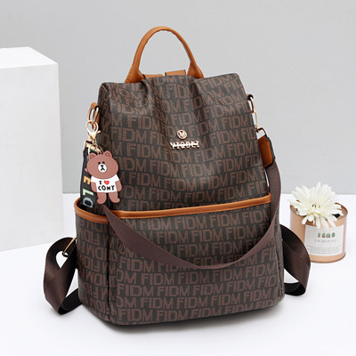 Γυναικείο σακίδιο πλάτης με μπρελόκ και λαβή ώμου