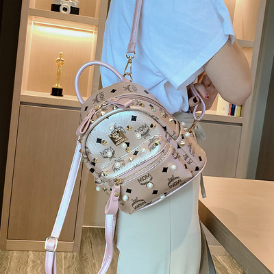 Νέο σακίδιο μικρού μεγέθους κατασκευασμένο από οικολογικό δέρμα με μαργαριτάρια και μεταλλικά πούλια