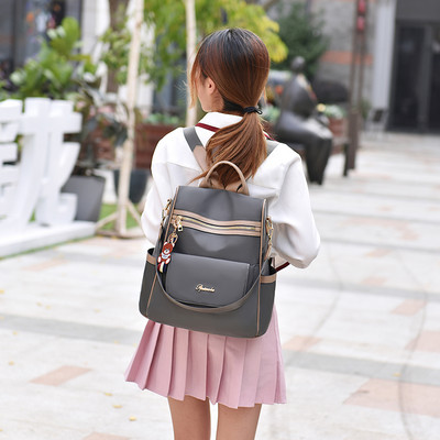 Γυναικείο υφασμάτινο σακίδιο με μπροστινή τσέπη με φερμουάρ και μεταλλικό στοιχείο