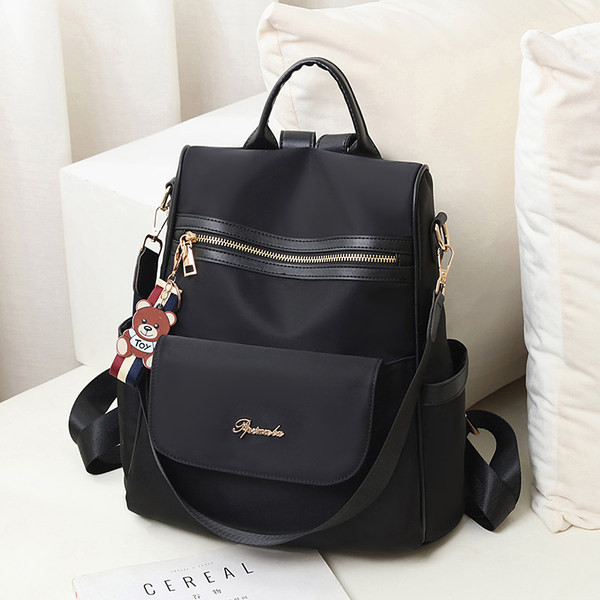 Γυναικείο υφασμάτινο σακίδιο με μπροστινή τσέπη με φερμουάρ και μεταλλικό στοιχείο