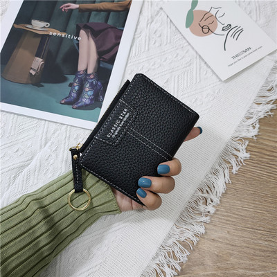 Sieviešu ādas somiņa ar uzrakstiem