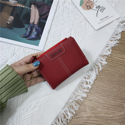 Sieviešu ādas somiņa ar uzrakstiem