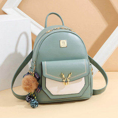 Γυναικείο σακίδιο οικολογικού δέρματος με φερμουάρ και μεταλλικά πριτσίνια στο πλάι