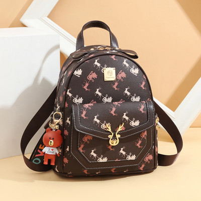 Γυναικείο σακίδιο από οικολογικό δέρμα με εφαρμογές και μεταλλικά στοιχεία