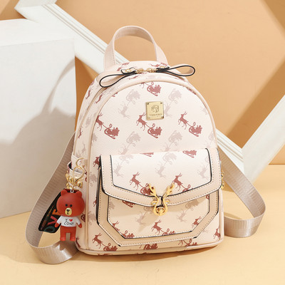 Γυναικείο σακίδιο από οικολογικό δέρμα με εφαρμογές και μεταλλικά στοιχεία