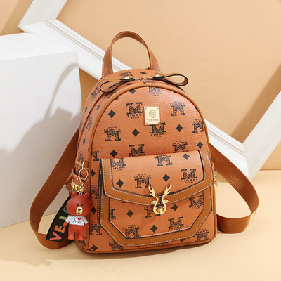 Μοντέρνο γυναικείο σακίδιο με απλικέ και μπροστινή τσέπη - οικολογικό δέρμα