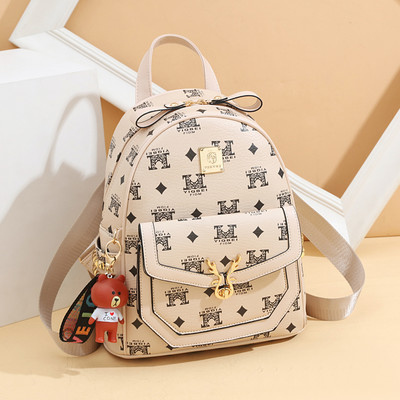 Μοντέρνο γυναικείο σακίδιο με απλικέ και μπροστινή τσέπη - οικολογικό δέρμα