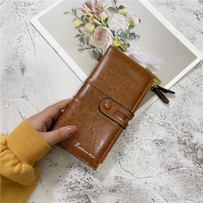 Moderni moteriška piniginė iš eko odos su užtrauktuku ir užsegimu