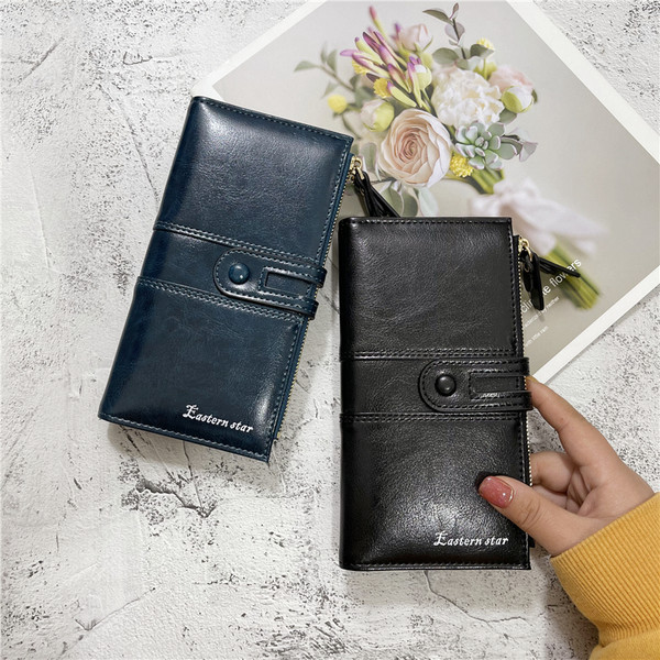 Moderni moteriška piniginė iš eko odos su užtrauktuku ir užsegimu