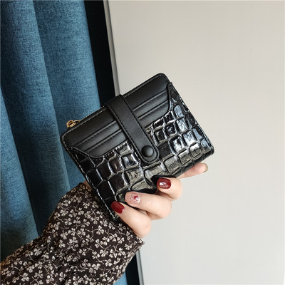 Moteriška keturių spalvų odinė piniginė