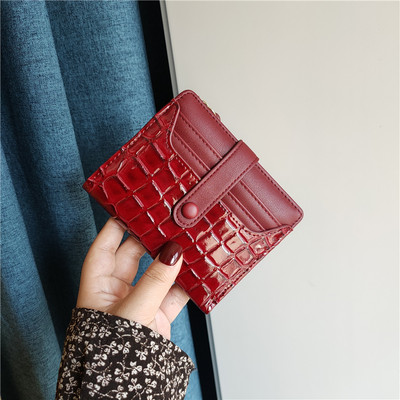 Moteriška keturių spalvų odinė piniginė