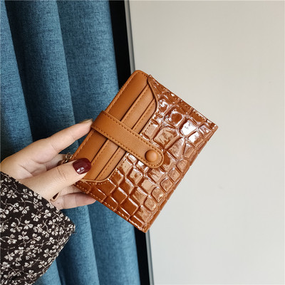 Moteriška keturių spalvų odinė piniginė