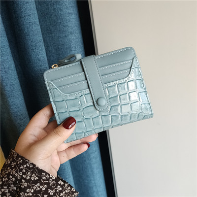 Moteriška keturių spalvų odinė piniginė