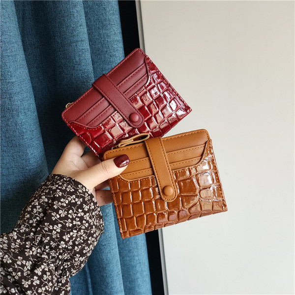 Moteriška keturių spalvų odinė piniginė