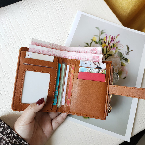 Moteriška keturių spalvų odinė piniginė