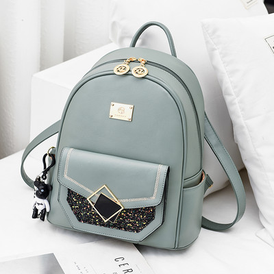 Γυναικείο σακίδιο με μεταλλικό στοιχείο και λαμπερά μοτίβα δύο μεγεθών