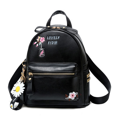 Γυναικείο σακίδιο με κεντήματα και μεταλλικά πριτσίνια