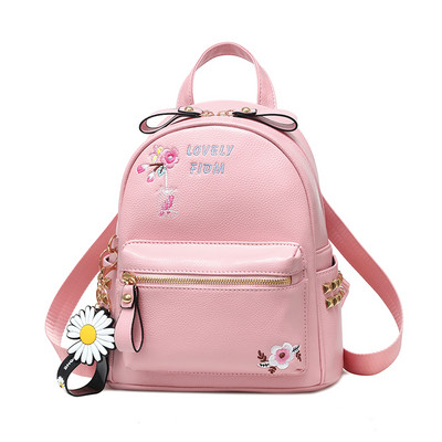 Γυναικείο σακίδιο με κεντήματα και μεταλλικά πριτσίνια