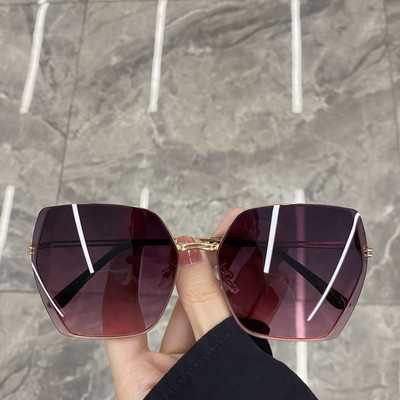 Jauns sieviešu saulesbriļļu modelis ar plānu rāmi